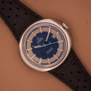 Omega Automatic Geneve Dynamic Ref. 166.107 Cal. 1421 with a bold blue and silver dial, automatic movement, and classic black leather strap.