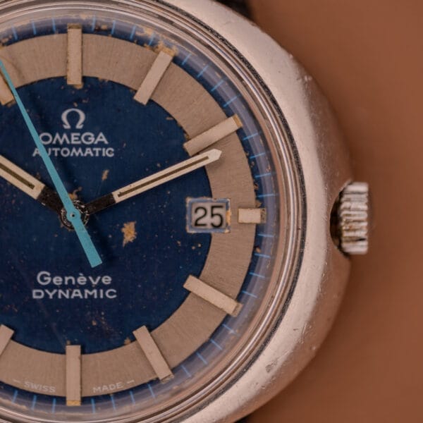 Close-up of an Omega Automatic Geneve Dynamic Ref. 166.107 Cal. 1421, showcasing a striking blue dial and date display set to 25.