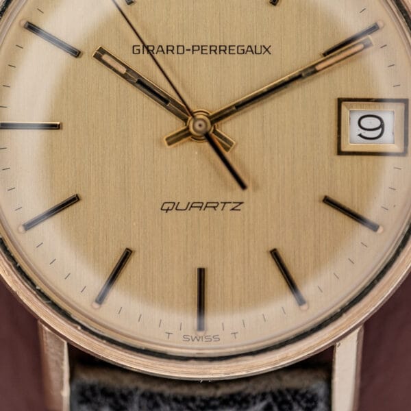 Close-up of a Girard Perregaux Quartz Date 3696 wristwatch with Champagne Dial (Cal. ETA 940), showing the time at 10:09 and the date set to the 9th.