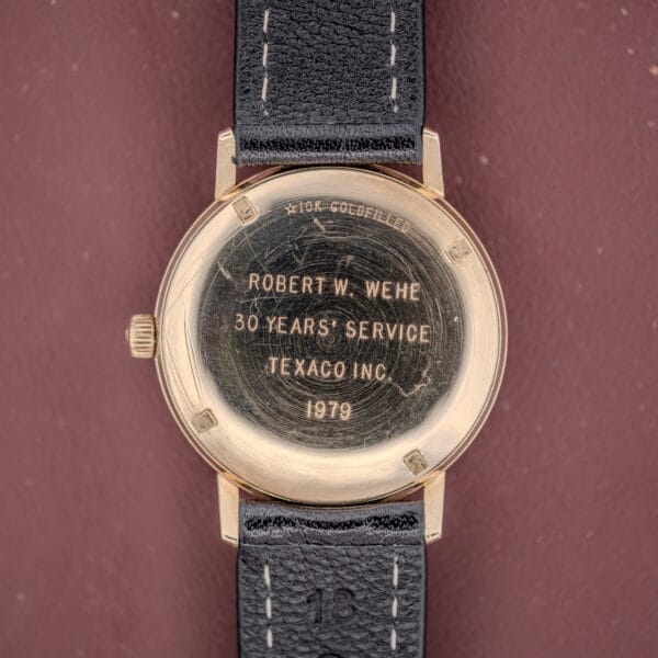 Girard Perregaux Quartz Date 3696 Champagne Dial Cal. ETA 940 watch, engraved “Robert W. Wehe 30 Years Service Texaco Inc. 1979,” with quartz movement and a black leather strap.