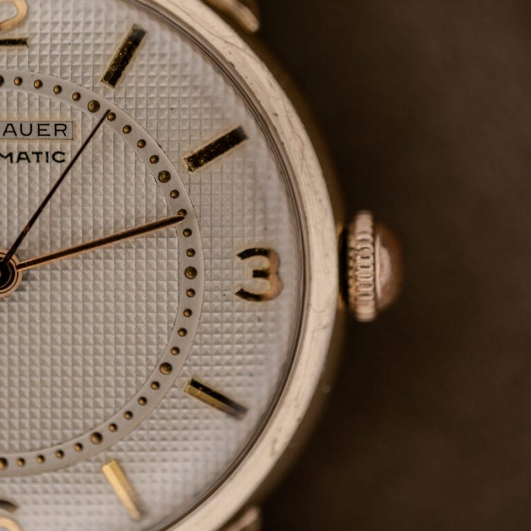 Close-up of a Wittnauer Automatic Waffle Dial Ref. 2023 with a 10k GF case, Cal. 11ARB, gold hour markers, and visible crown on the right side.