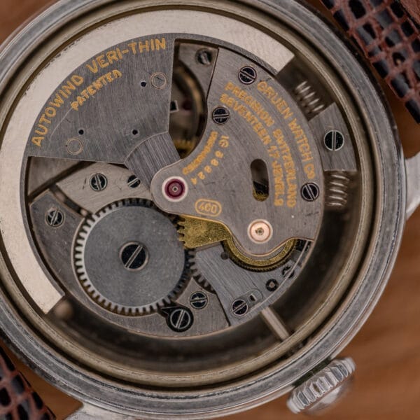 Close-up of the intricate inner mechanical workings of a vintage Gruen Precision Auto-Wind Copper Dial in Stainless Steel Cal. 400 wristwatch movement.