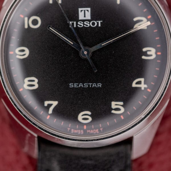 Close-up of the Tissot Seastar Ref. 42568, showcasing a matte black dial, white numerals, and a sleek stainless steel case with Cal. 781-1 movement.