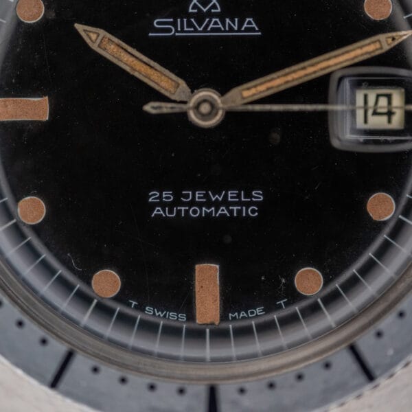 Close-up of a Silvana 25 Jewels Automatic Skin Diver Cal. 2472 watch with black dial, showing the date set to the 14th.