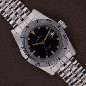 Vintage Silvana skin diver Cal. 2472 with glossy black dial, caramel tritium plots, and original signed beads-of-rice bracelet, top-down.