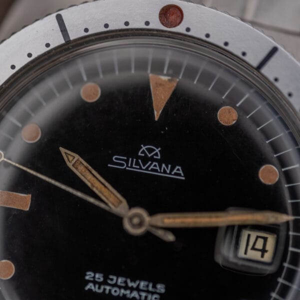 Close-up of the Silvana 25 Jewels Automatic Skin Diver Cal. 2472 Black Dial showing its date window, hands, and "25 Jewels Automatic" text—a classic diver's watch with the Cal. 2472 movement.