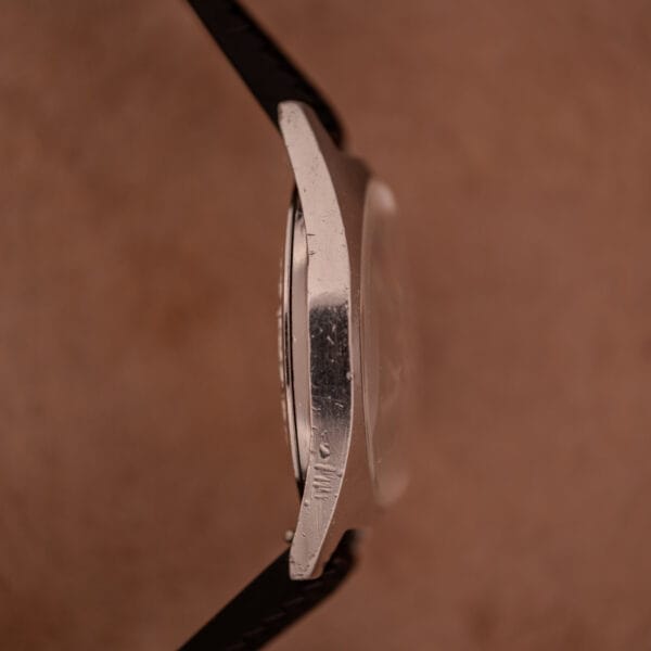 A close-up side view of the Aquastar 1701 Skin Diver 200 Meters Automatic with a Tropic Rubber Strap, shown against a brown background.