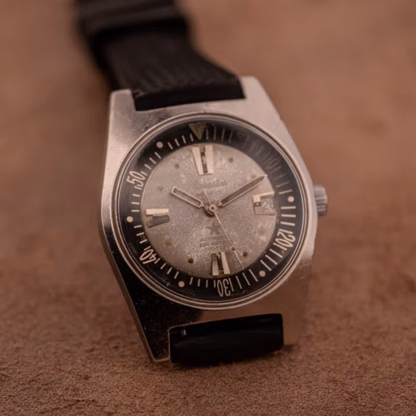 Aquastar 1701 Skin Diver on black tropic-style rubber strap, full front view showing cushion-form steel case and internal black dive bezel.