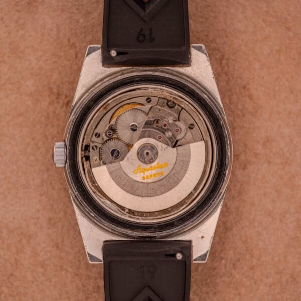 Aquastar 1701 caliber AS 1700/01 automatic movement with gilt cursive Aquastar Genève signed rotor and Incabloc shock setting at the balance.