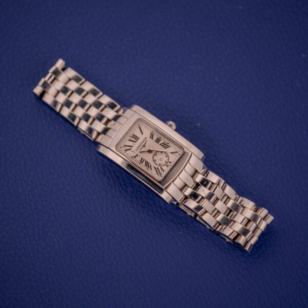 The Longines Dolce Vita L5.155.4 features a stainless steel tank case and Roman numerals on a textured blue dial.