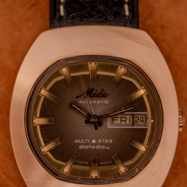 Close-up of a vintage Mido Automatic Multi Star Datoday Cal. 1819 Ref. 6929300 wristwatch, displaying Friday the 24th.