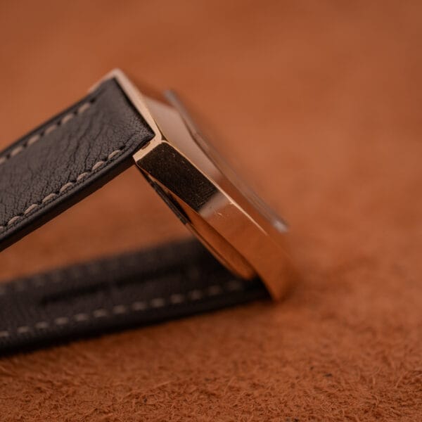 Close-up of a Mido Automatic Multi Star Datoday Cal. 1819 Ref. 6929300 wristwatch with a leather strap, resting on a textured brown surface.