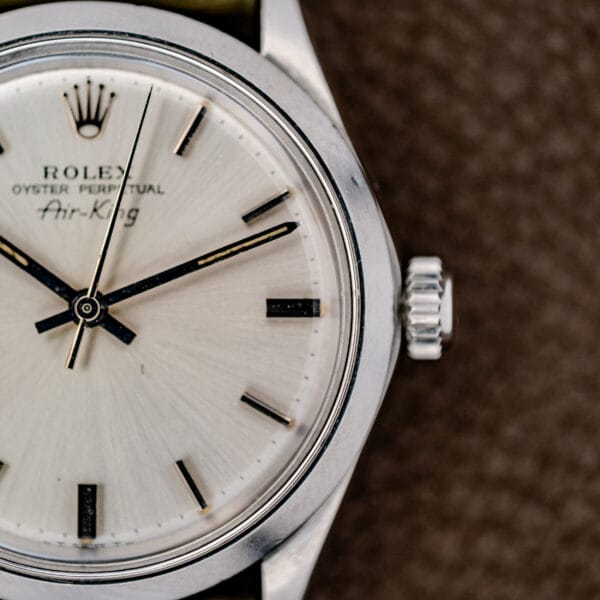 Close-up of the Rolex Oyster Perpetual Air King Ref. 5500, showcasing its Silver Sunburst Dial and bold black hour markers.