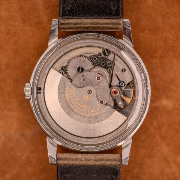 Close-up of the Zodiac Glorious Automatic Ref. 702-917, showcasing its Cal. 70-72 movement with visible gears from the caseback, set in a stainless steel case on a leather strap.