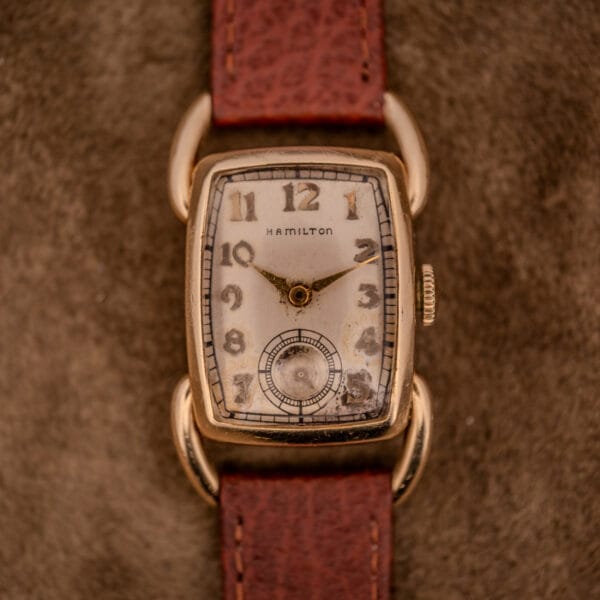 A Hamilton Bowman Art Deco wristwatch with a 10k gold filled case and manual wind Cal. 980 movement, featuring a leather strap and some light dial wear.