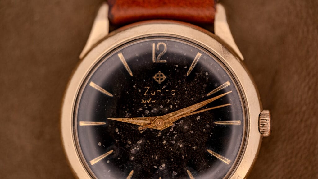 A zodiac with a black dial