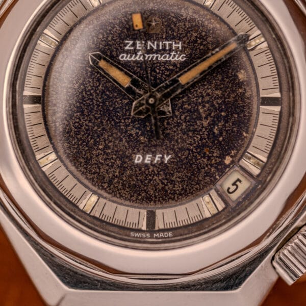 Close-up of a Zenith Automatic Defy NA.50.012.2 in Stainless Steel Cal. 2562 PC, displaying the date at 5 and a weathered dial.