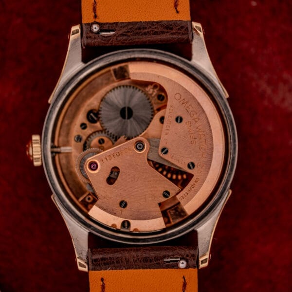 Close-up of the Omega Automatic Bumper Ref. 2582 14k Gold Capped, highlighting the exposed Cal. 351 movement with visible gears and engraved details—demonstrating mechanical precision and classic design.