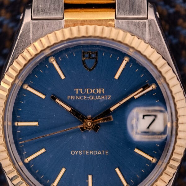 Close-up of Tudor Prince-Quartz Oysterdate Ref. 9150 featuring a striking two-tone blue dial with the date set to 7.