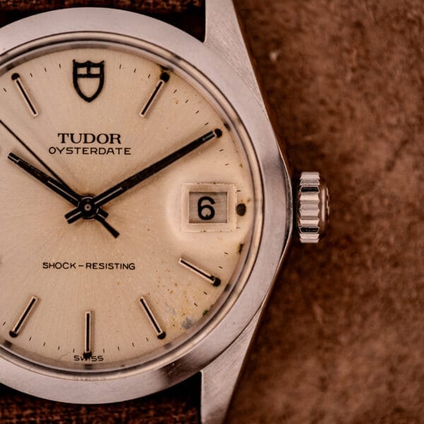 Close-up of a Tudor Oysterdate Ref. 90120 Stainless Steel Sunburst Dial watch with a date window showing the number 6.