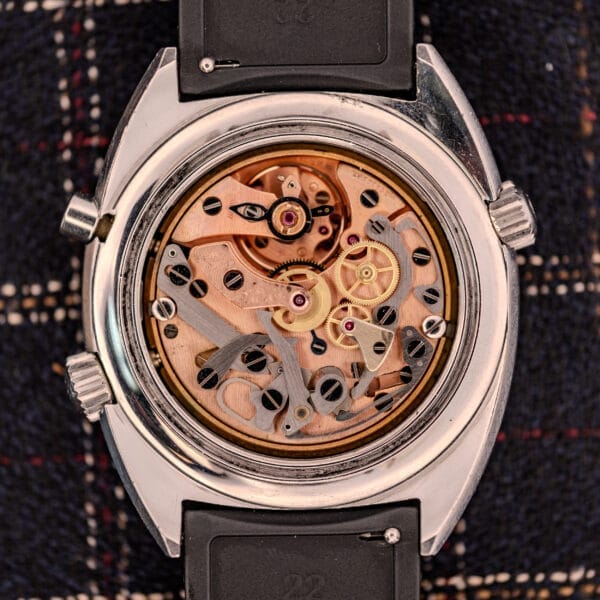 Close-up of an open Omega Seamaster Ref. 145.008 Chronostop Regatta showing the intricate gears and inner mechanical movement of the Cal. 865.
