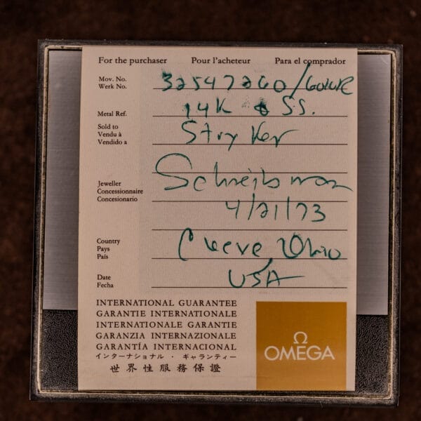 Omega international guarantee card with handwritten serial number, date, buyer's location, and details for the Omega Constellation Chronometer Ref. 168.045 Day/Date Full Set.