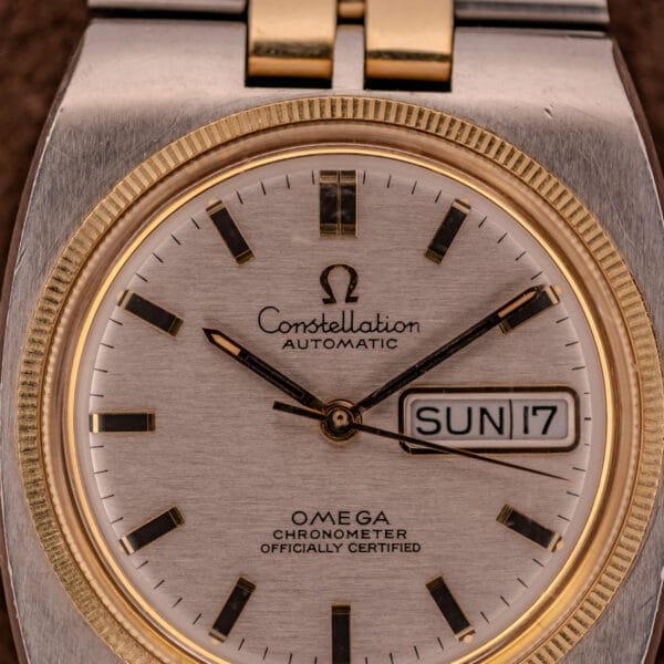 Close-up of the Omega Constellation Chronometer Ref. 168.045 Day/Date Full Set watch showing SUN and 17, featuring an elegant silver and gold design.