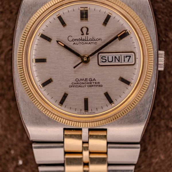 Close-up of an Omega Constellation Chronometer Ref. 168.045 Day/Date Full Set wristwatch showing the time as 3:06 and the date as Sunday 17.