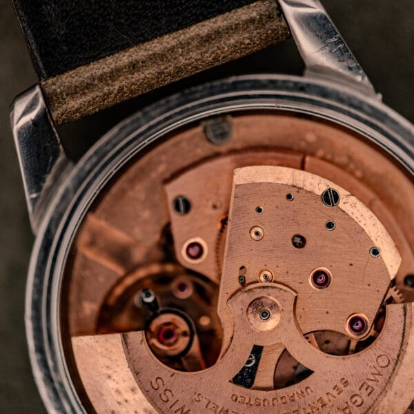 Close-up of the inner mechanical gears and parts of an Omega Automatic Seamaster Ref. 2848 Black Dial Cal. 500 wristwatch.