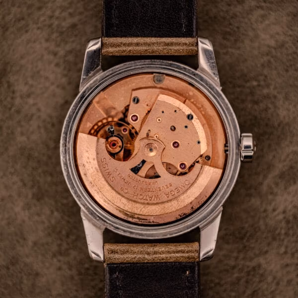 Caseback removed showing the caliber 500 automatic of the Omega Seamaster Ref. 2848 with copper-toned bridges and signed rotor