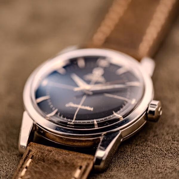 Low-angle profile of the Omega Seamaster Ref. 2848 showing the broad sloped lugs and stainless steel case