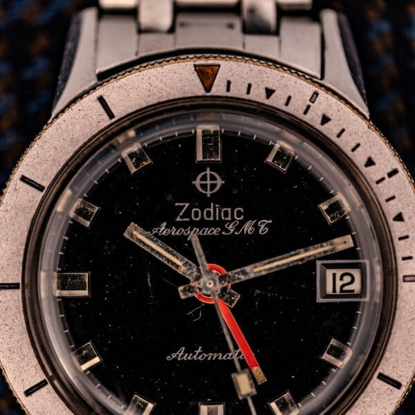 Close-up of Zodiac Aerospace GMT Ref. 752-934, showcasing its black dial, chrome bezel, and date window at 3 o’clock.