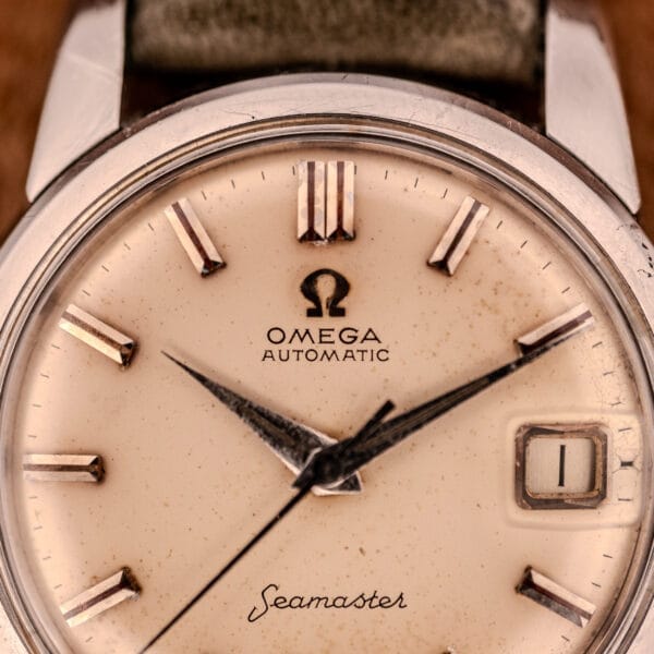 Close-up of an Omega Automatic Seamaster Ref. 2849 Stainless Steel Chunky Lugs, showcasing a cream dial and date window at 3 o’clock.