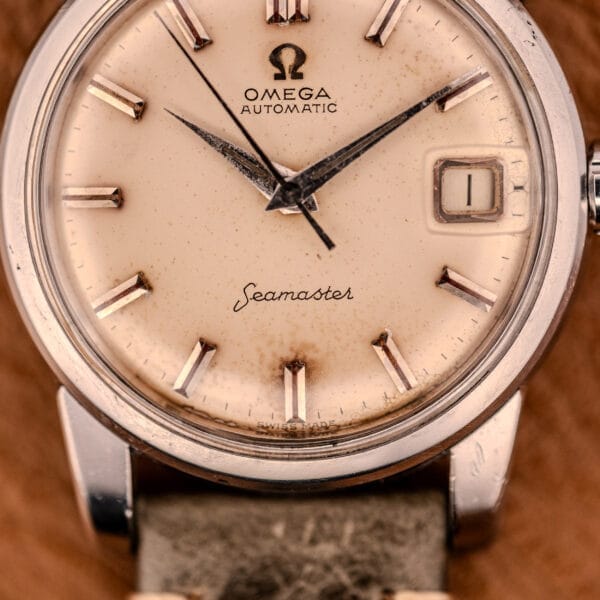 Close-up of an Omega Automatic Seamaster Ref. 2849 Stainless Steel Chunky Lugs, showcasing a cream dial with silver markers and hands in a classic case.