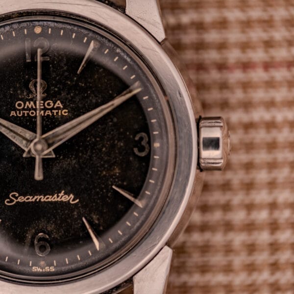 Close-up of the 1956 Omega Seamaster Automatic Ref. 2828-6 SC Cal. 470 Stainless Steel, highlighting the logo, dial, and hands in detail.