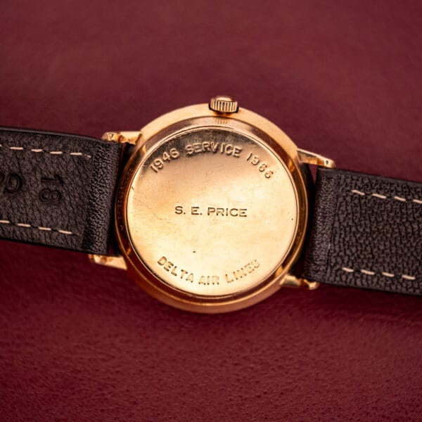 Hamilton Thin-O-Matic 10k Gold Filled Case Automatic wristwatch on a dark leather band, back engraved "1946 SERVICE 1963, S. E. PRICE, DELTA AIR LINES," offering timeless elegance and reliable automatic movement.