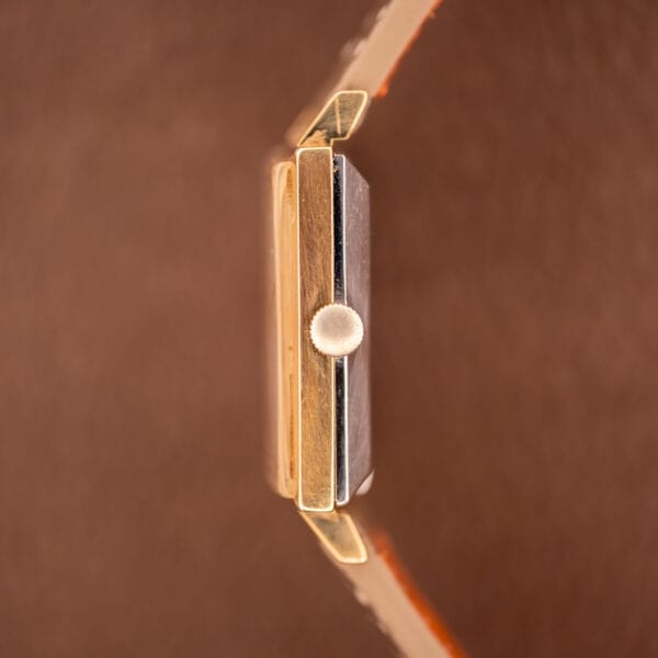 Close-up side view of the Zodiac Ref. 523-007 Square Case Manual Wind Cal. 52 wristwatch, featuring a brown leather strap, metallic winding crown, and distinctive square case.