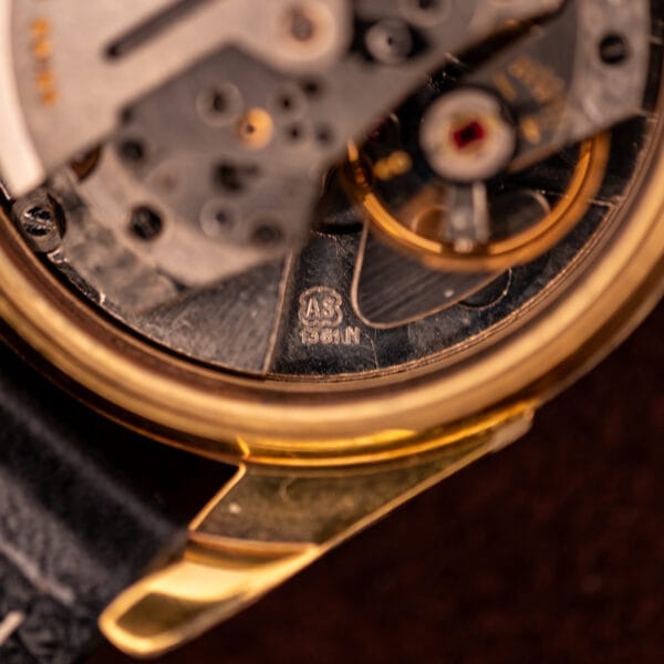 Close-up of a mechanical watch movement with gears, gold rim, and engravings—an elegant detail reflecting the craftsmanship of vintage Zodiac Rotographic Ref. 656 Tropic Dial Automatic Cal. 1381 models.