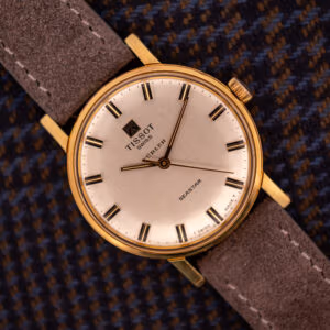 Tissot Seastar Ref. 42520-3 Türler dial vintage watch on charcoal blue tweed, gold plated case with dauphine hands