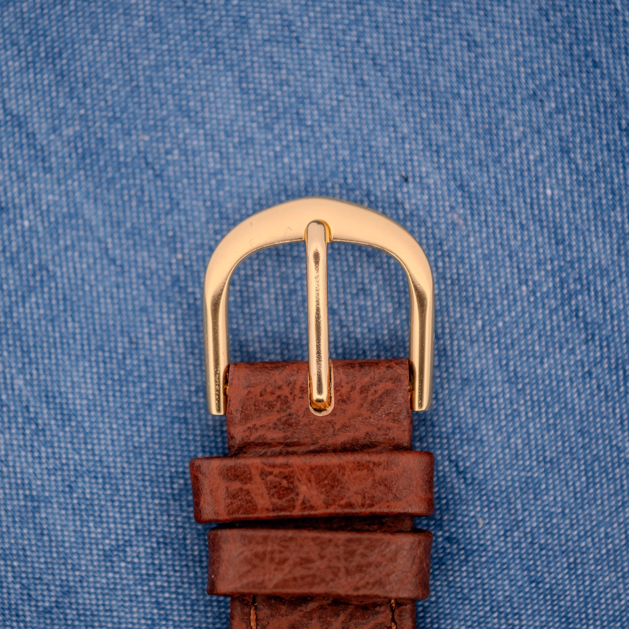 Gold-tone polished pin buckle on the OTTUHR brown leather strap paired with this 1950s Cyma Cymaflex.