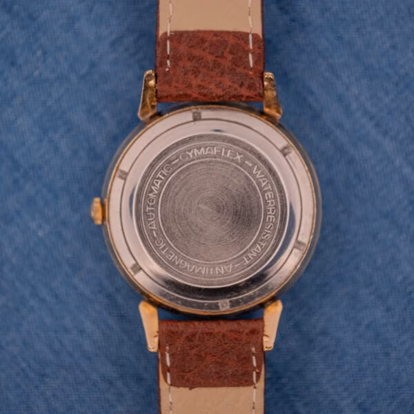 Cyma Cymaflex caseback stamped AUTOMATIC CYMAFLEX WATERRESISTANT ANTIMAGNETIC with spiral wear pattern from decades of servicing.