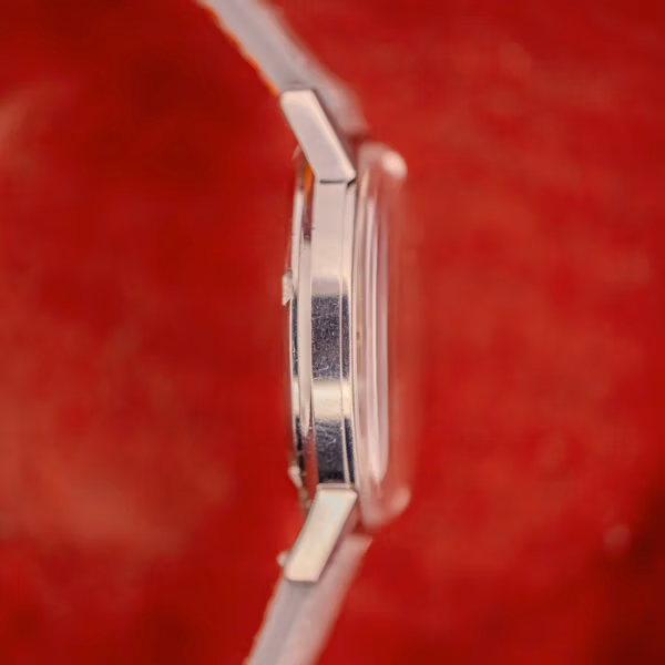 Opposite side profile of Omega Seamaster 165.002 stainless steel case showing slim mid-1960s Seamaster proportions