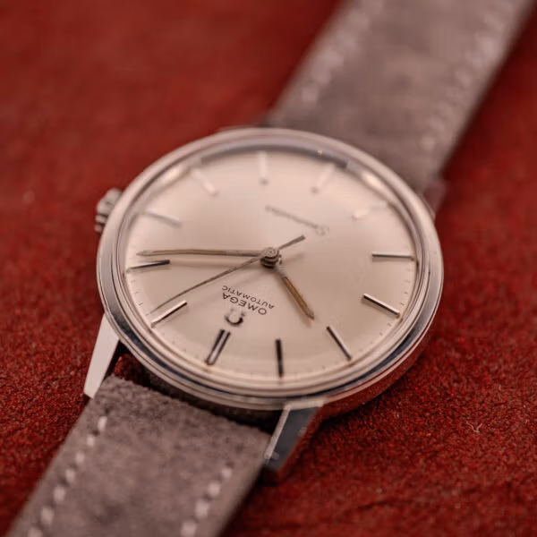 Omega Seamaster 165.002 dial photographed inverted showing radial sunburst finish and crown at three o'clock