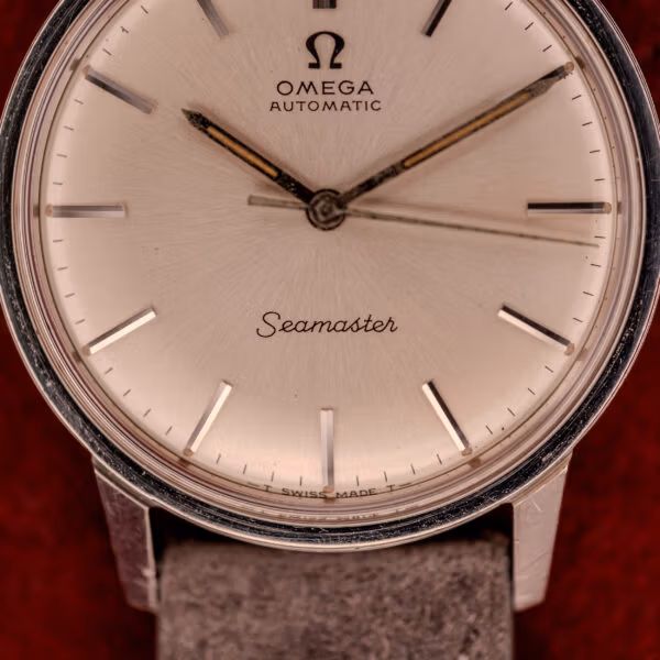 Omega Seamaster 165.002 lower-dial close-up showing Seamaster cursive script and T SWISS MADE T tritium designation