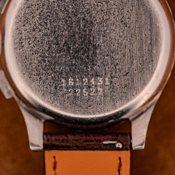 The back of a worn Jaeger Tri-Compax Chronograph Ref. 22522 stainless steel case, engraved with the numbers 612431 and 22522.