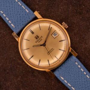 Tissot Seastar Automatic Ref. 44-520-4 with champagne sunburst dial on blue calf strap, gold-plated 34mm case, dauphine hands.