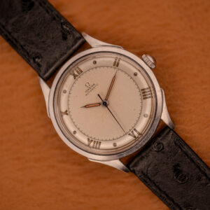 Omega Automatic Bumper 2584-1 factory cream dial with applied steel Roman numerals, top-down on black ostrich leather strap