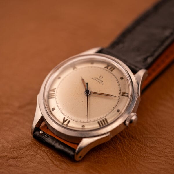 Omega Automatic Bumper 2584-1 three-quarter front view on black ostrich leather, dial centered
