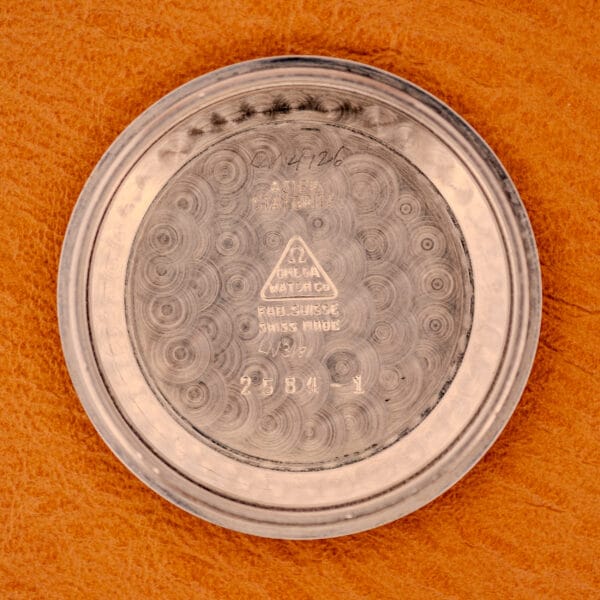 Omega Pre-Seamaster 2584-1 inner caseback stamping reading ACIER INOXYDABLE, Omega Watch Co. triangle logo, FAB. SUISSE, SWISS MADE, and reference 2584-1
