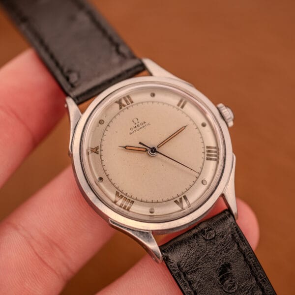 Omega Pre-Seamaster 2584-1 presented in hand on black ostrich leather strap with OTTUHR signed buckle